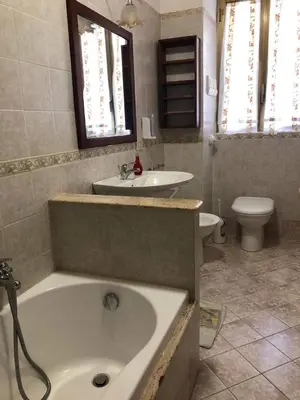 a bathroom with a tub and a sink and a toilet at Capo Seralcadio in Palermo