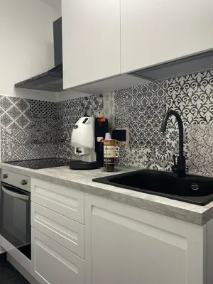 a kitchen with a sink and a mixer on a counter at Casa Vacanze Donna Sidora in Palermo