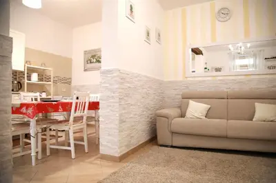 a living room with a table and a couch at La Maison Du Centre in Palermo