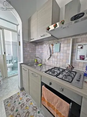 a kitchen with a stove top and a sink at Sikulamente in Palermo