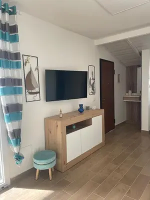 a living room with a flat screen tv on a wall at Villa Vittoria in Trappeto