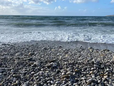 a group of rocks on a beach near the ocean at Villa Vittoria in Trappeto