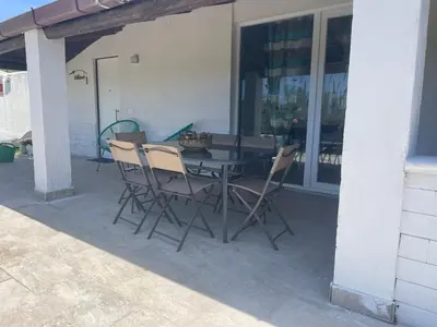 a table and chairs sitting on a patio at Villa Vittoria in Trappeto