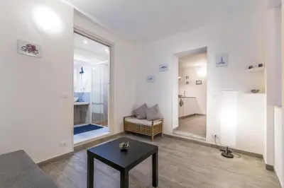 a living room with a couch and a table at Vuccirihouse in Palermo