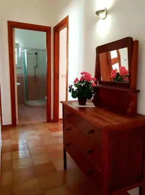 a dresser with a mirror on top of it at VILLA FLAMINIA - con piscina privata in San Vito lo Capo