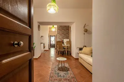 a living room with a couch and a table at Good Vibes apartment nel centro storico in Palermo