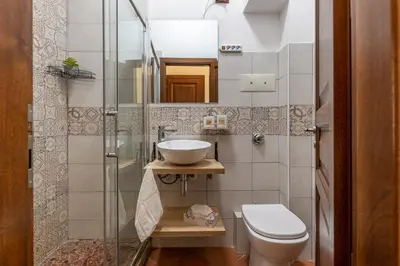 a small bathroom with a sink and a toilet at Good Vibes apartment nel centro storico in Palermo
