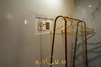 a room with a wall with a microwave and a switch at ARCUM suites in Palermo