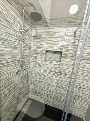 a shower stall with a toilet in a bathroom at Casa vacanze La Bonta' di Palermo in Palermo