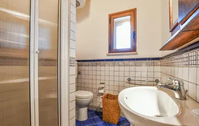a bathroom with a tub and a toilet and a sink at Stunning Home In Trappeto With Wifi in Trappeto