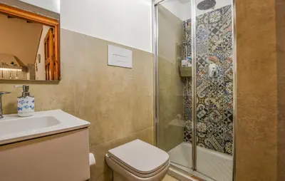 a bathroom with a shower and a toilet and a sink at Stunning Home In Trappeto With Wifi in Trappeto
