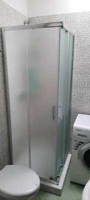 a glass shower in a bathroom with a toilet at Casa Lisa in San Vito lo Capo
