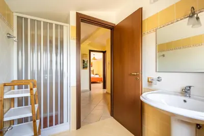 a bathroom with a sink and a mirror at Villa Panorama in Trappeto