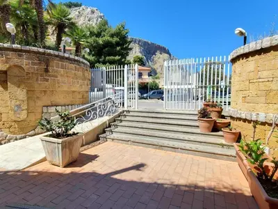 a set of stairs with a white fence and plants at Ashur 163 - Mondello in Palermo
