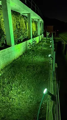 a row of lights on the side of a building at night at Villini AltaVista in Altavilla Milicia