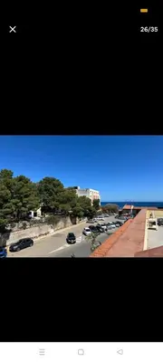 a view of a street with cars parked in a parking lot at La casa di maretta,Mondello in Palermo