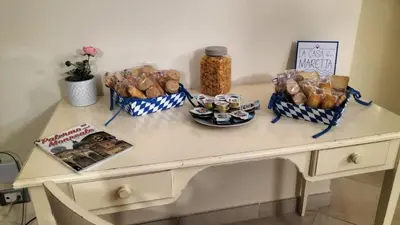 a table with baskets of bread and snacks on it at La casa di maretta,Mondello in Palermo