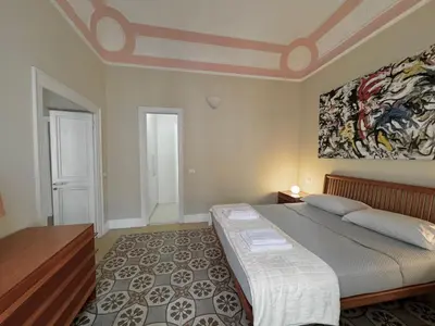 a hallway with a mirror and a table in a room at La casa di Alice Palermo Casa Professa in Palermo