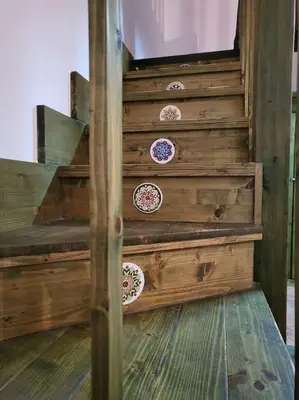 a wooden stair case with plates on it at Casa Vacanze Sole in Castellammare del Golfo