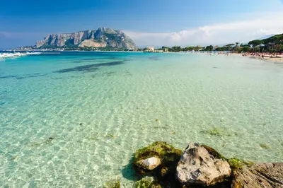 a view of a beach with rocks in the water at La Casa di Anna, Mondello in Palermo