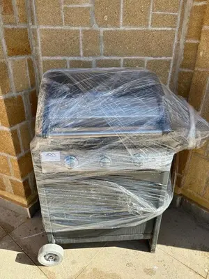 two containers wrapped in plastic sitting next to a brick wall at La Casa di Anna, Mondello in Palermo