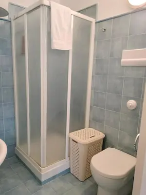a bathroom with a toilet and a shower at La Casa di Anna, Mondello in Palermo