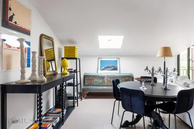 a living room with a table and chairs at Casa Mediterranea Attitudine By DomuSicily in Mondello
