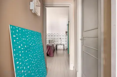 a hallway with a door leading to a room at Casa Mediterranea Attitudine By DomuSicily in Mondello