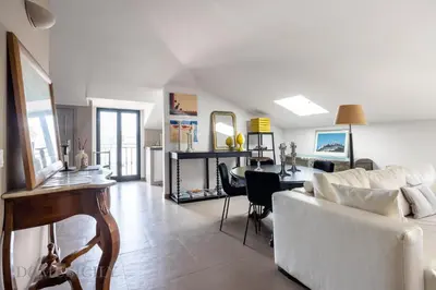 a living room with a couch and a table at Casa Mediterranea Attitudine By DomuSicily in Mondello