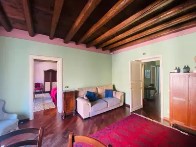 a living room with a couch and a table at casetta mon amour in Palermo