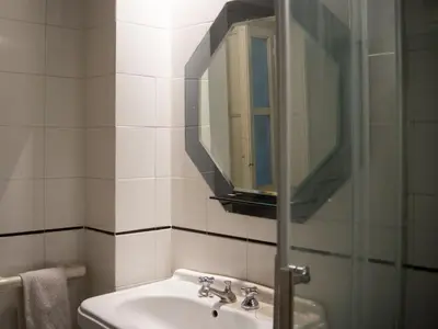 a bathroom with a sink and a mirror at casetta mon amour in Palermo