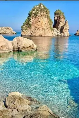 an island in the ocean with rocks in the water at Villa Nuccia Oasi di relax con piscina in Castellammare del Golfo
