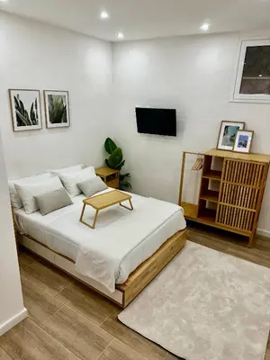 a bedroom with a bed with a table on it at Aloha in Palermo