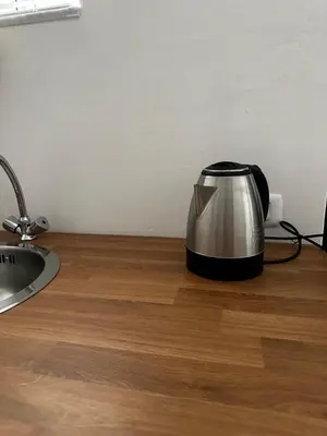 a toaster sitting on a counter next to a sink at Aloha in Palermo