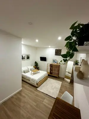 a living room with a bed and a couch at Aloha in Palermo