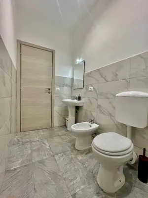 a bathroom with a toilet and a sink at Casa Politeama Florio - Palermo centro in Palermo