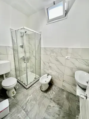 a bathroom with a shower and a toilet and a sink at Casa Politeama Florio - Palermo centro in Palermo