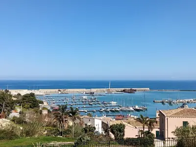 a view of a harbor with boats in the water at La Casetta di Nino in Castellammare del Golfo