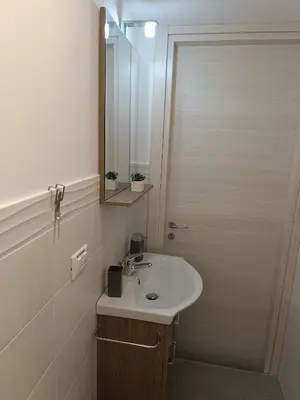 a bathroom with a sink and a mirror at La Casetta di Nino in Castellammare del Golfo