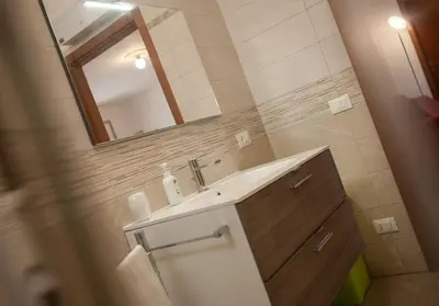 a bathroom with a sink and a mirror at Villa Laura in Balestrate