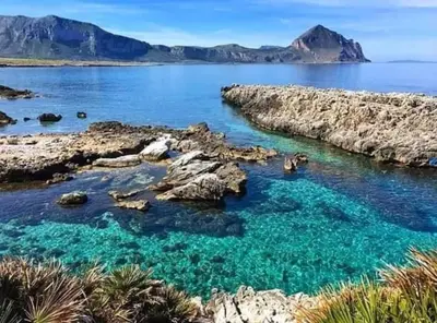 a view of a body of water with mountains at Alykè Appartamenti Vacanze Macari in Macari