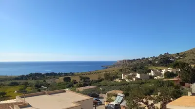 a view of the ocean from a house at Alykè Appartamenti Vacanze Macari in Macari