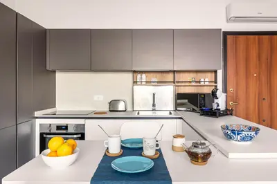 a kitchen with a counter with a bowl of fruit on it at FronteMare in Palermo