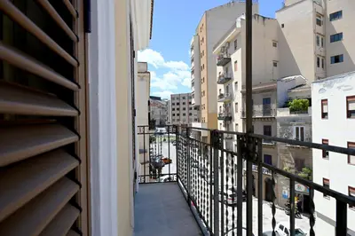 a balcony with a view of a city at Politeama Theater Apartments in Palermo