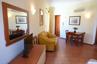 a living room with a couch and a table at Politeama Theater Apartments in Palermo