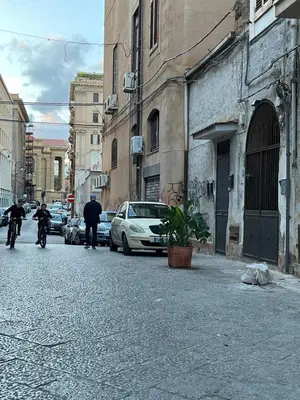 a group of people riding motorcycles on a city street at GRETA'S APARTMENT DISCESA DELLE CAPRE in Palermo