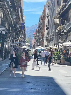 a group of people walking down a city street at GRETA'S APARTMENT DISCESA DELLE CAPRE in Palermo