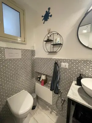 a bathroom with a toilet and a sink at Studio 29 in Palermo