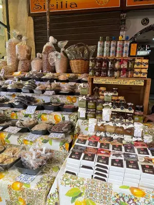 a display of food on a table in a market at Studio 29 in Palermo