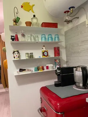 a kitchen with a red appliance on a counter at Studio 29 in Palermo
